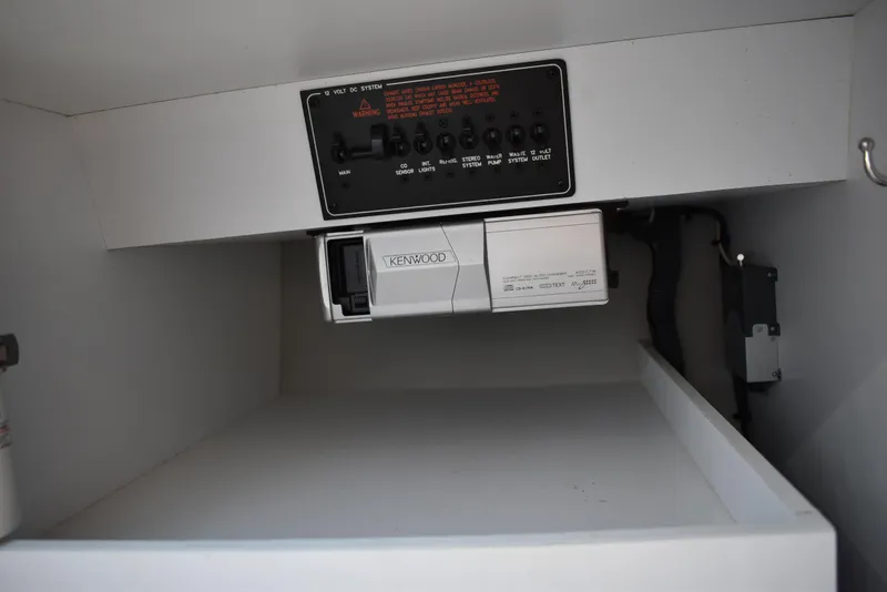 Slide: The Image of 2008 Formula 353 FASTech interior compartment with control panel and Kenwood audio system. - 33