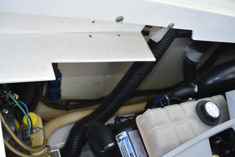 Slide: The Image of Engine compartment of 2008 Formula 353 FASTech boat, showing hoses and components. - 43