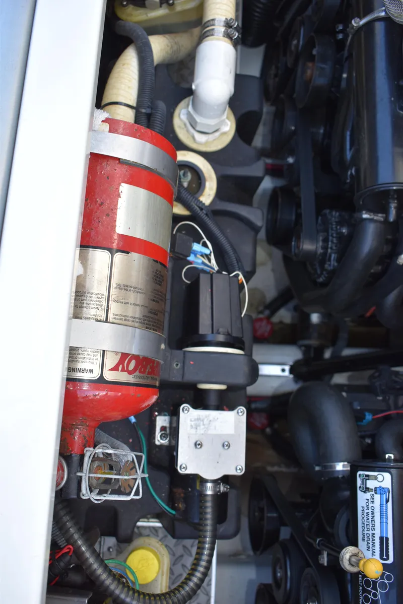 Slide: The Image of Engine compartment of 2008 Formula 353 FASTech with fire extinguisher and mechanical components. - 45