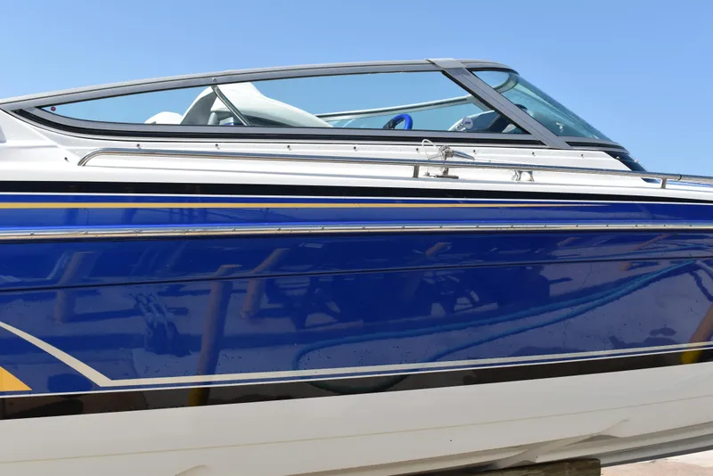 Slide: The Image of 2008 Formula 353 FASTech boat with sleek blue and white design. - 6