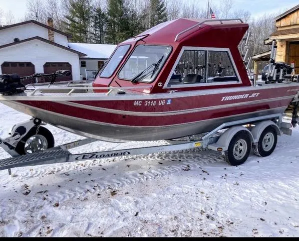 Slide: The Image of 2019 Thunder Jet 185 Explorer boat on trailer in snowy driveway. - 4