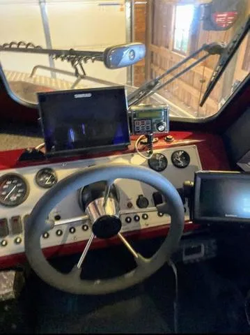 Slide: The Image of 2019 Thunder Jet 185 Explorer dashboard with steering wheel and navigation instruments. - 9