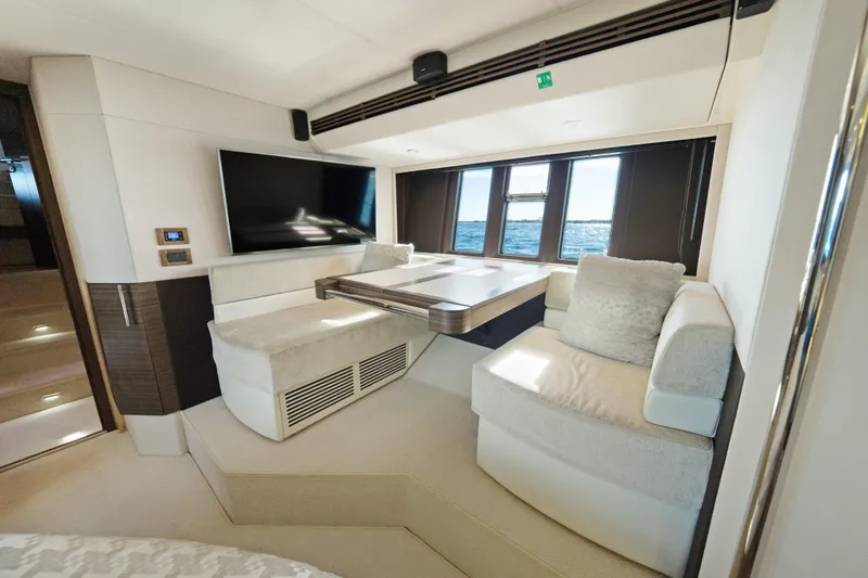 Slide: The Image of Luxurious interior of 2017 Azimut 60 Flybridge yacht with plush seating and large windows. - 23