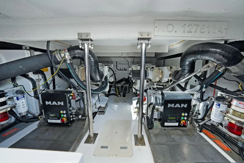 Slide: The Image of Engine room of 2017 Azimut 60 Flybridge yacht, featuring MAN engines and mechanical components. - 41