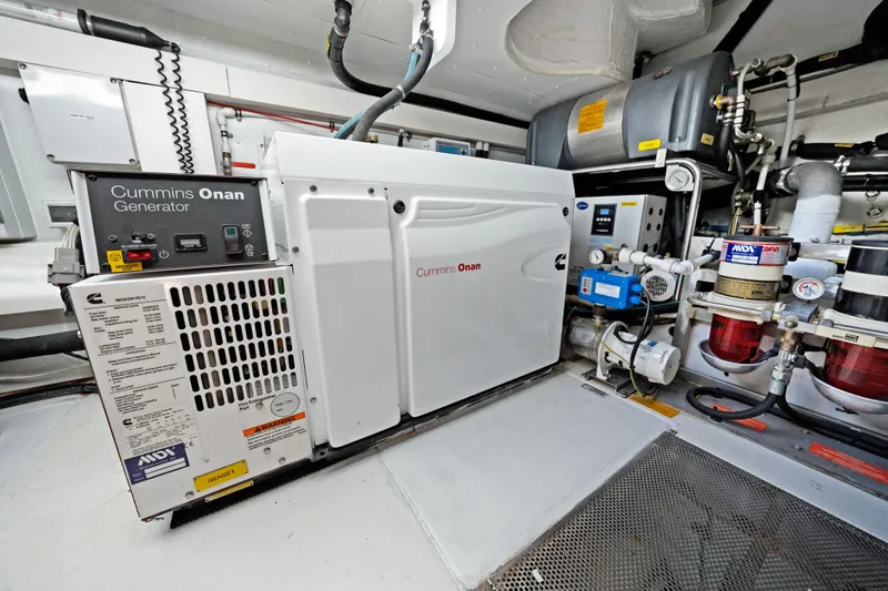 Slide: The Image of Engine room of 2017 Azimut 60 Flybridge with Cummins Onan generator. - 42