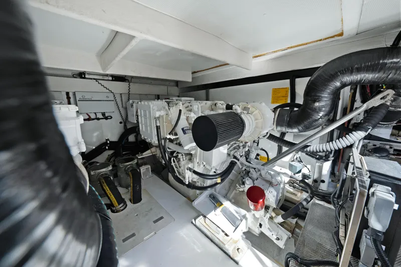Slide: The Image of Engine room of 2017 Azimut 60 Flybridge yacht, showcasing mechanical components and systems. - 44