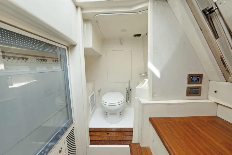 Slide: The Image of Bathroom interior of 2017 Azimut 60 Flybridge yacht, featuring modern fixtures and wooden accents. - 46