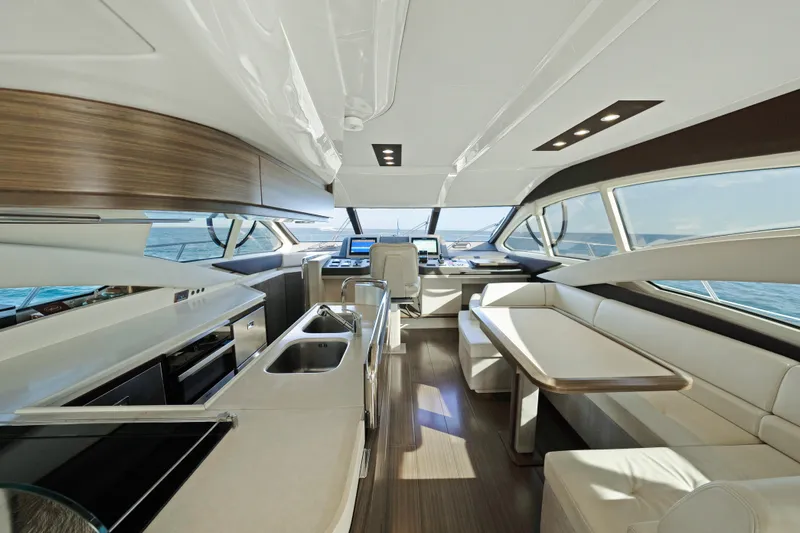 Slide: The Image of Luxurious interior of 2017 Azimut 60 Flybridge yacht with modern kitchen and seating area. - 9