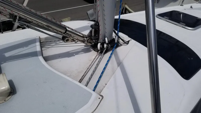 Slide: The Image of Deck of 1999 Hunter 340 sailboat with rigging and ropes visible. - 4