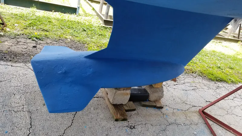 Slide: The Image of Blue keel of a 1999 Hunter 340 sailboat on a stand. - 6