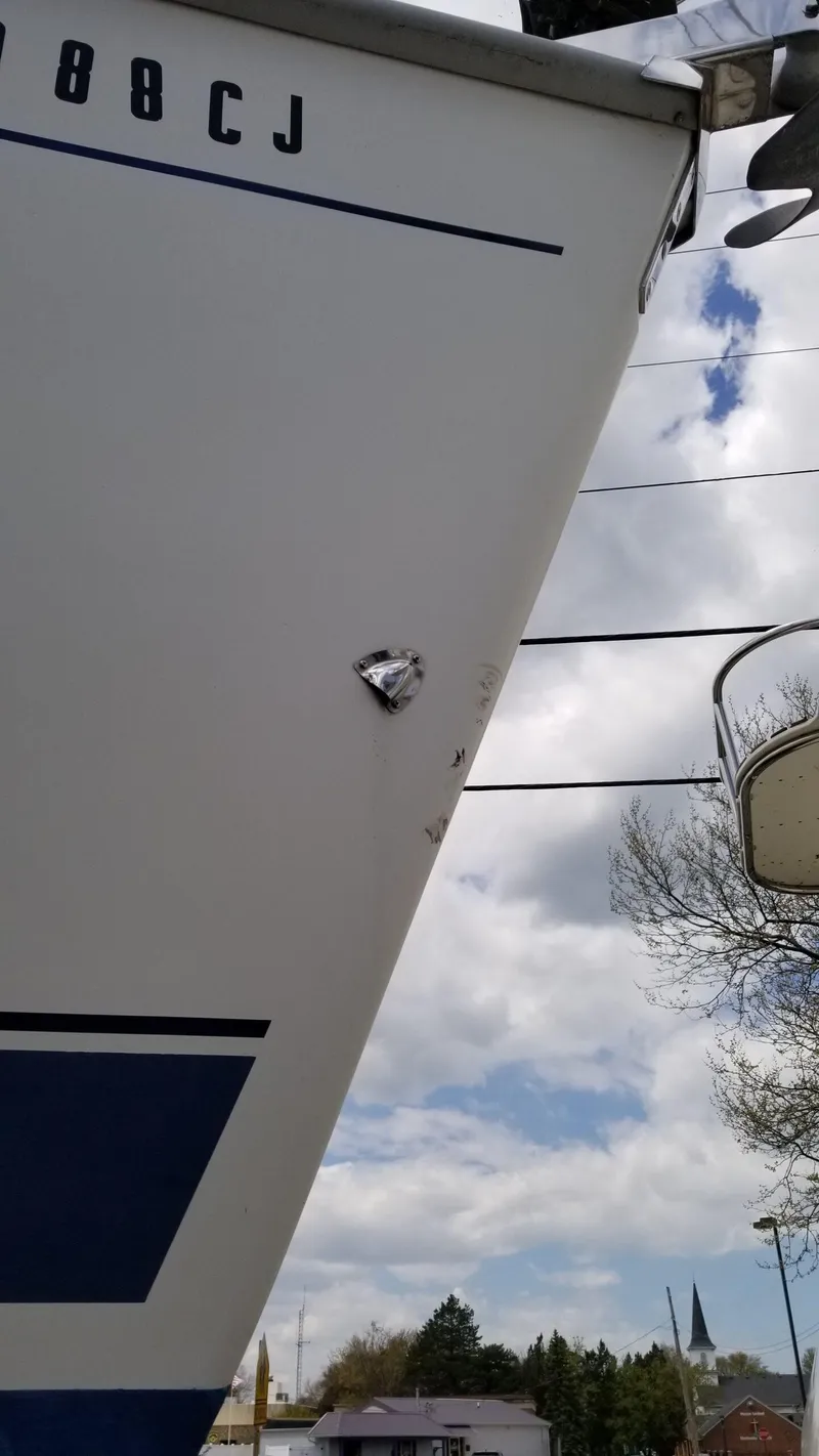 Slide: The Image of 1999 Hunter 340 sailboat bow against cloudy sky background. - 7