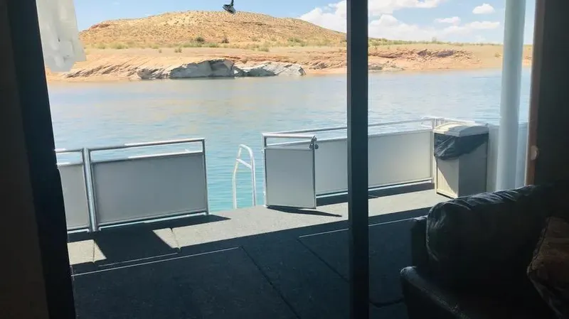Slide: The Image of Houseboat deck view of serene lake and rocky landscape, Adonia Inspiration Trip #14, 2019. - 11