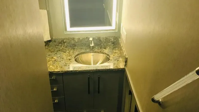 Slide: The Image of Modern bathroom with granite countertop and illuminated mirror in Adonia Inspiration Trip #14, 2019. - 15