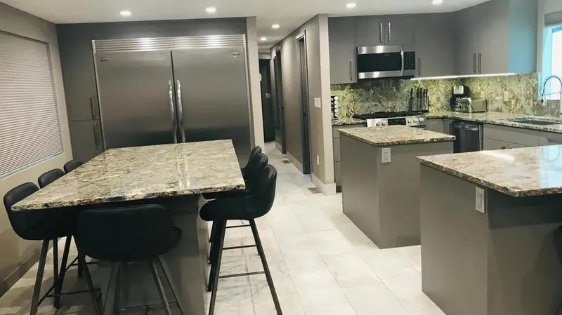 Slide: The Image of Modern kitchen with granite countertops, stainless steel appliances, and sleek cabinetry, Adonia Inspiration Trip #14. - 3