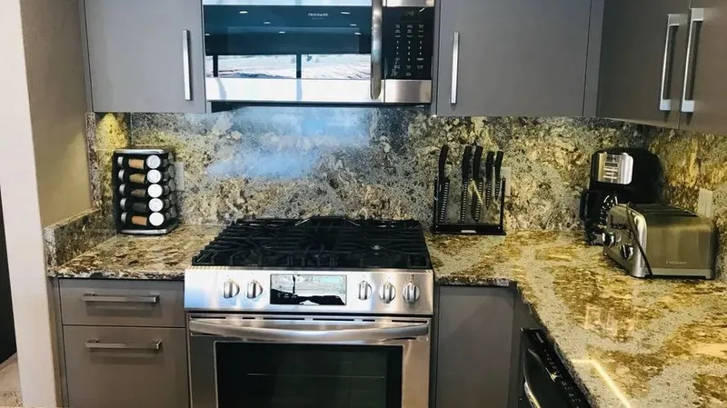 Slide: The Image of Modern kitchen with stainless steel appliances, granite countertops, and sleek cabinetry, Adonia Inspiration Trip #14. - 5