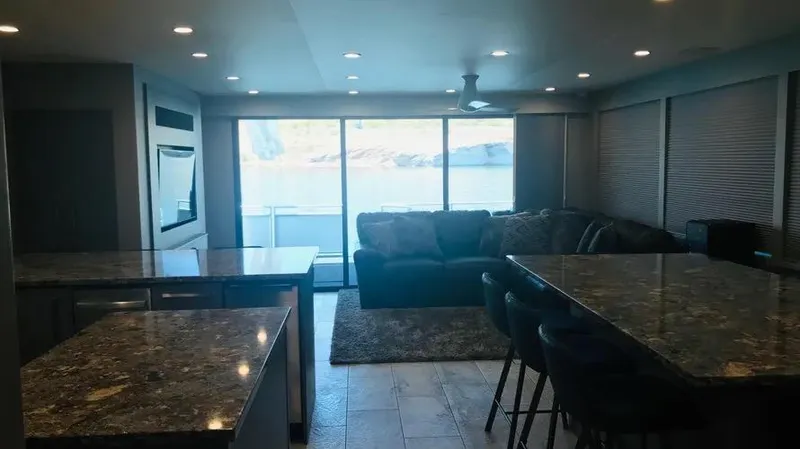 Slide: The Image of Modern living area with large windows, granite countertops, and comfortable seating on Adonia Inspiration Trip #14. - 8