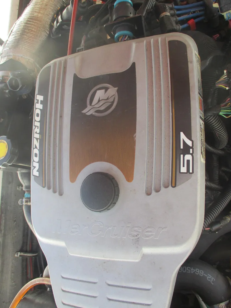 Slide: The Image of Engine of 2001 Shamrock 246 Walkaround boat, featuring Horizon 5.7 MerCruiser. - 19