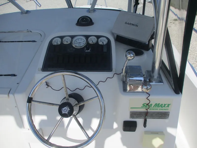 Slide: The Image of Steering console of 2001 Shamrock 246 Walkaround boat with Garmin GPS and gauges. - 21