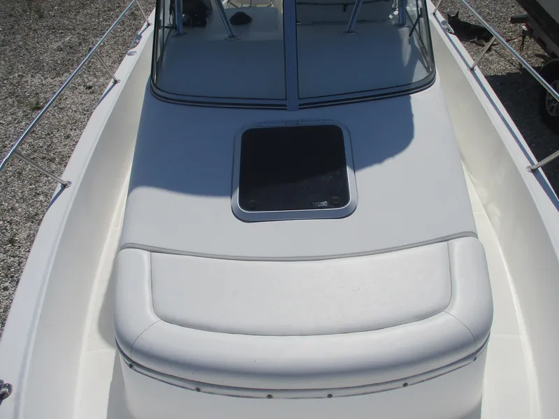 Slide: The Image of 2001 Shamrock 246 Walkaround boat deck with hatch and seating. - 26