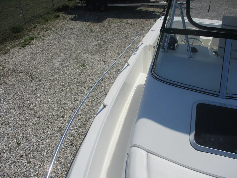 Slide: The Image of 2001 Shamrock 246 Walkaround boat deck with railing and windshield. - 29