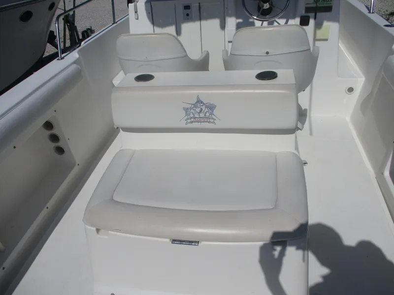 Slide: The Image of 2001 Shamrock 246 Walkaround boat interior with seating and steering wheel. - 9