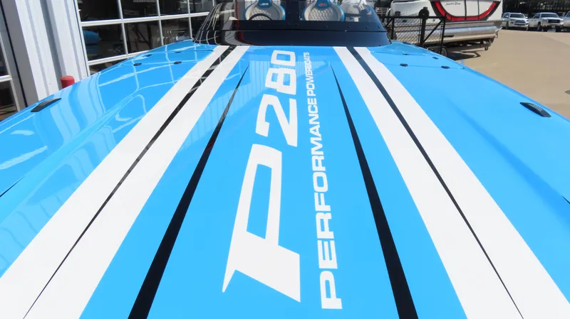 Slide: The Image of 2025 Wright Performance P280 boat with blue and white racing stripes. - 6