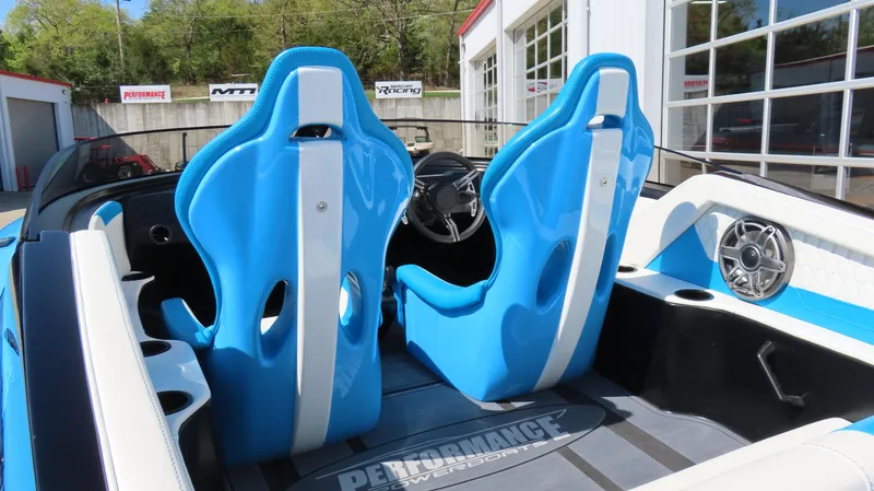 Slide: The Image of 2025 Wright Performance P280 boat interior with blue racing seats and modern dashboard. - 7