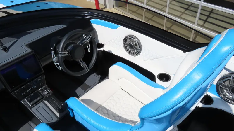 Slide: The Image of Interior of 2025 Wright Performance P280 boat with blue and white seating and modern dashboard. - 8