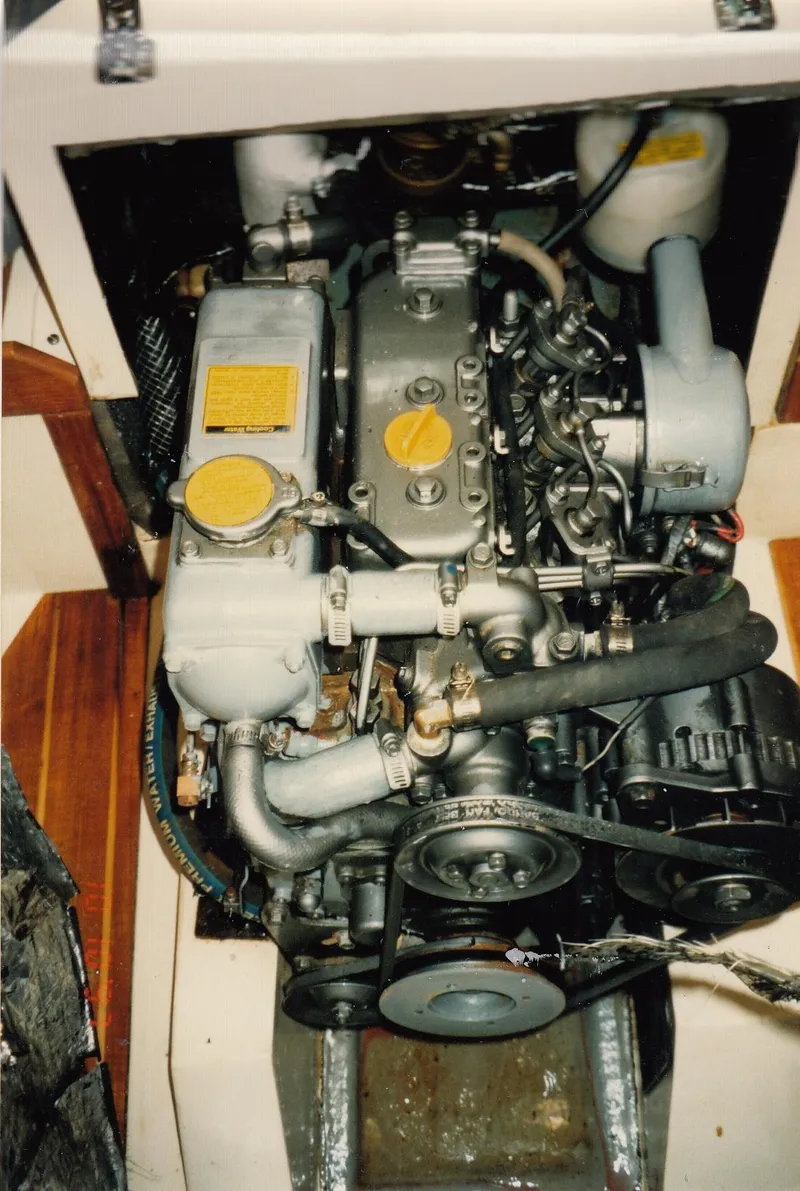 Slide: The Image of 1988 CAL Sloop engine compartment with visible mechanical components and belts. - 16