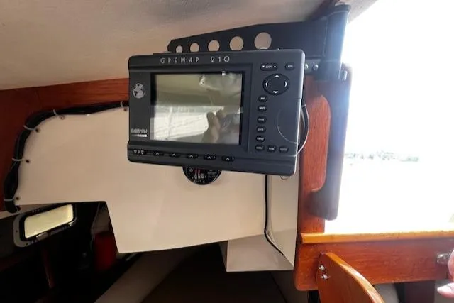 Slide: The Image of GPS device mounted inside a 1988 CAL Sloop sailboat cabin. - 8