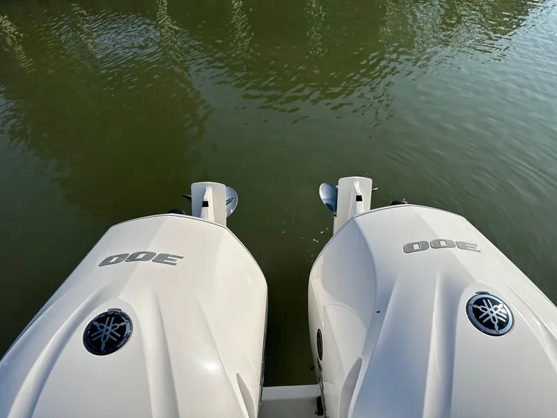 Slide: The Image of Twin Yamaha 300 outboard engines on a 2019 Regulator 28 boat, viewed from above. - 16