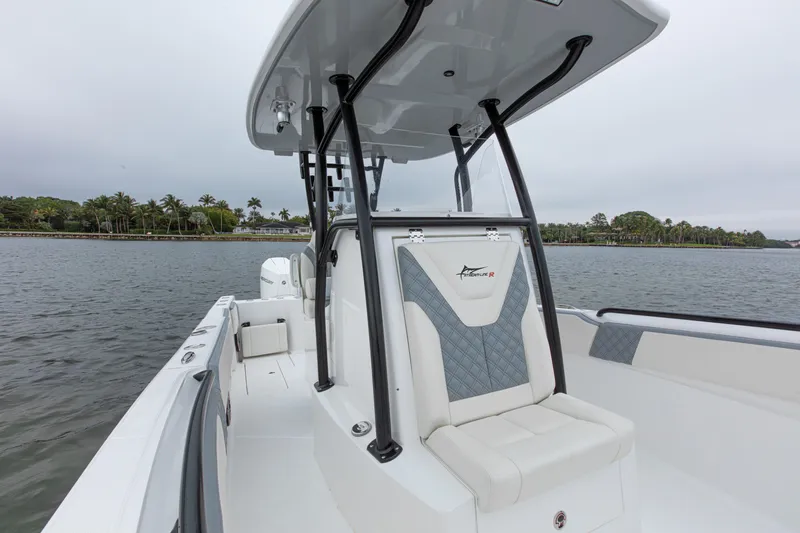 Slide: The Image of 2024 Streamline 26 CC boat on water, featuring sleek design and comfortable seating. - 20