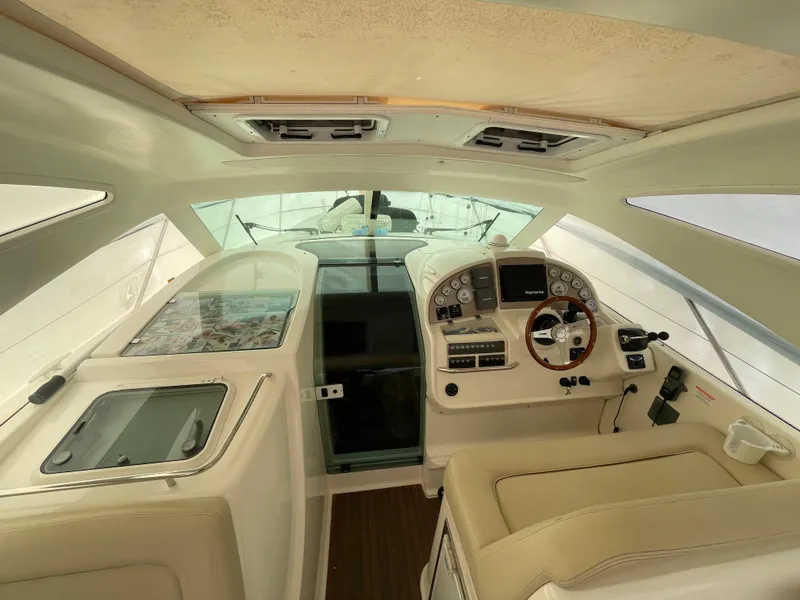Slide: The Image of 2008 Jeanneau Prestige 34 Hardtop cockpit with steering wheel and navigation controls. - 13