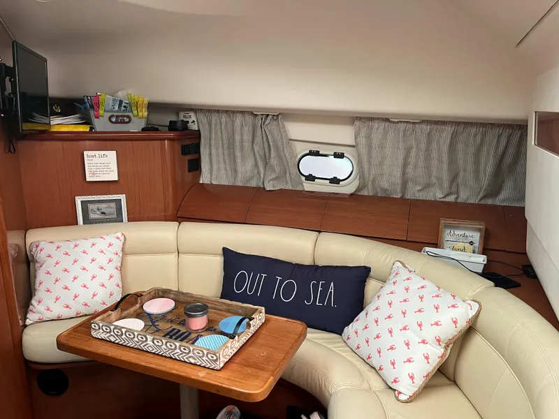 Slide: The Image of Interior of 2008 Jeanneau Prestige 34 Hardtop with cozy seating and nautical decor. - 17