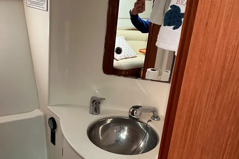Slide: The Image of Bathroom interior of 2008 Jeanneau Prestige 34 Hardtop yacht with sink and mirror. - 19