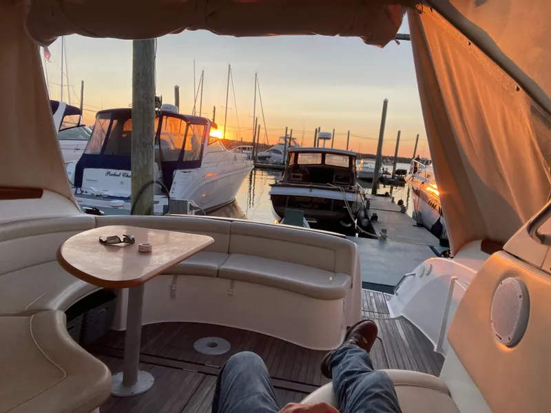 Slide: The Image of 2008 Jeanneau Prestige 34 Hardtop interior with sunset marina view. - 7