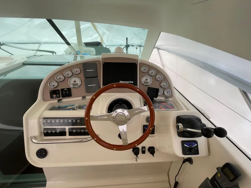 Slide: The Image of Helm of 2008 Jeanneau Prestige 34 Hardtop with wooden steering wheel and control panel. - 9