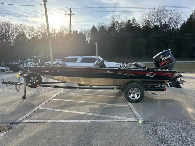 Slide: The Image of 2011 G3 Eagle 190 boat with Yamaha motor on trailer, parked outdoors. - 11