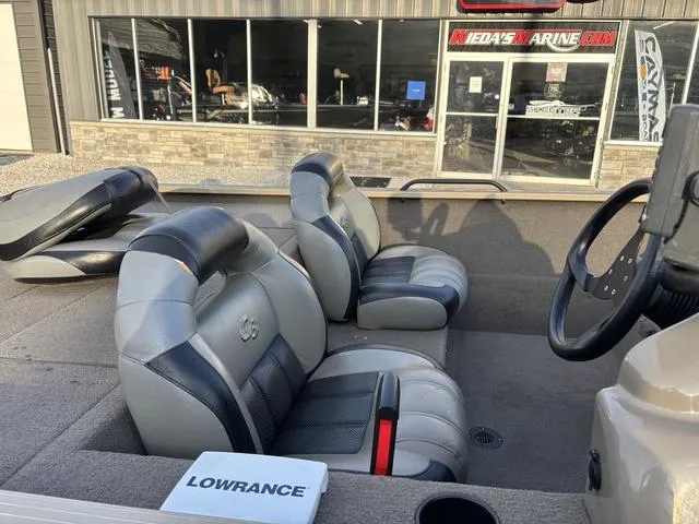 Slide: The Image of 2011 G3 Eagle 190 boat interior with gray seats and Lowrance equipment. - 5