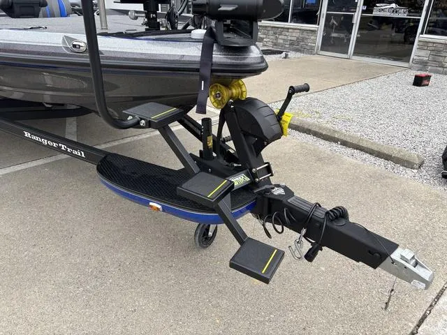 Slide: The Image of 2023 Ranger Z521R boat trailer hitch and steps on pavement. - 10