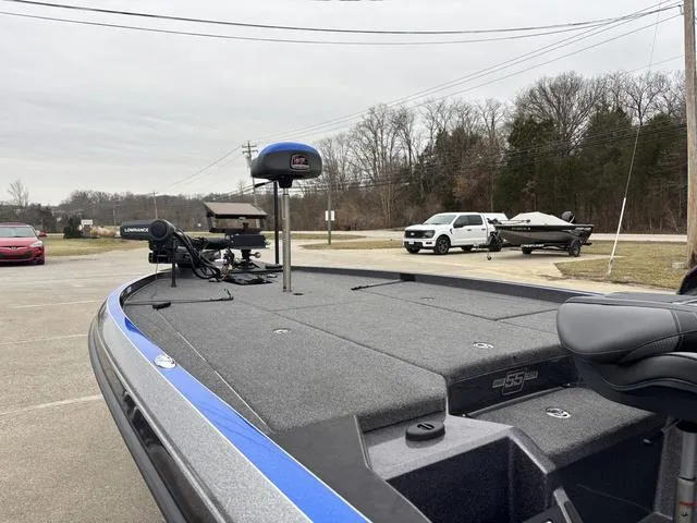 Slide: The Image of 2023 Ranger Z521R boat with advanced fishing equipment in a parking lot. - 14