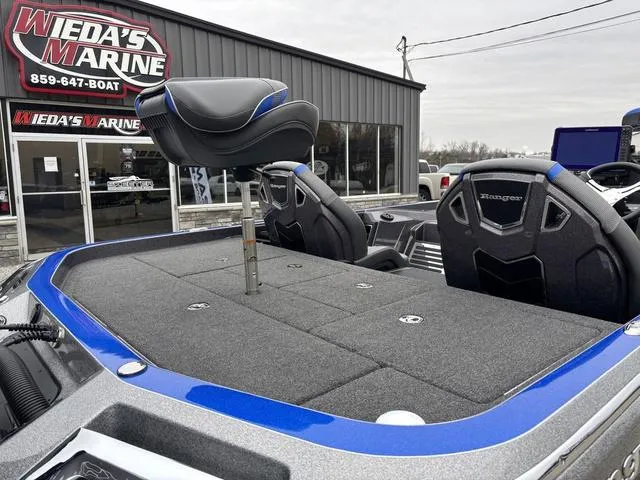 Slide: The Image of 2023 Ranger Z521R boat at Wieda's Marine dealership, featuring a sleek seating area. - 5