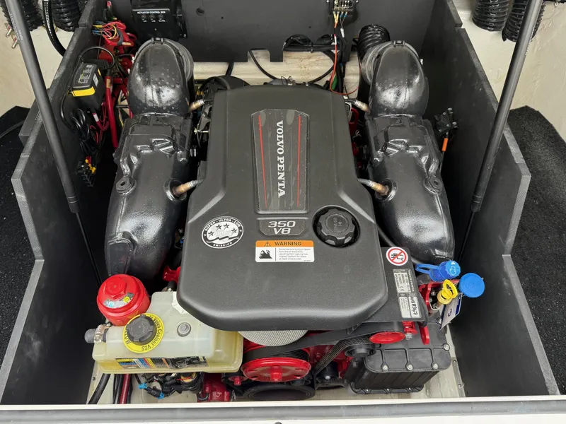 Slide: The Image of 2023 Regal LS6 engine compartment featuring a Volvo Penta 350 V8 engine. - 2