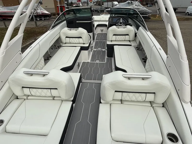 Slide: The Image of 2023 Regal LS6 boat interior with luxurious white seating and modern design. - 6