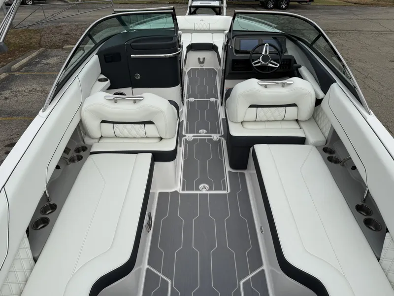 Slide: The Image of 2023 Regal LS6 boat interior with white seating and sleek design. - 7