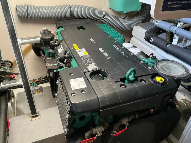 Slide: The Image of Engine room featuring a Volvo Penta engine in a 2015 Prestige 500 yacht. - 18