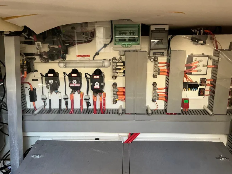 Slide: The Image of Electrical panel of a 2015 Prestige 500 yacht with various switches and wiring. - 21