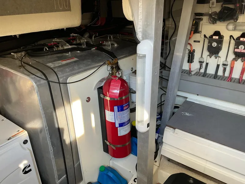 Slide: The Image of Engine room of a 2015 Prestige 500 yacht with fire extinguisher and tools. - 22