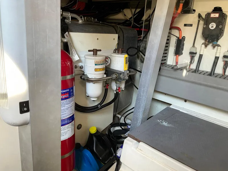 Slide: The Image of Engine room of 2015 Prestige 500 yacht with fire extinguisher and fuel filters. - 25