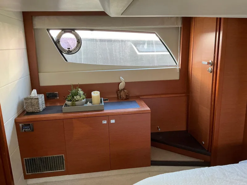 Slide: The Image of Luxurious interior of a 2015 Prestige 500 yacht cabin with modern decor. - 31